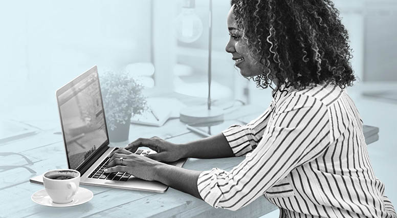 A woman consults her laptop